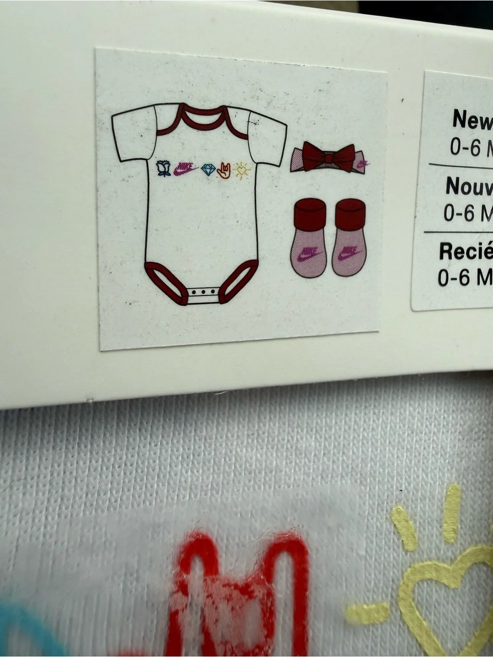 New girls Nike Baby 3-Piece Set in White and Red with Multicolor Icons